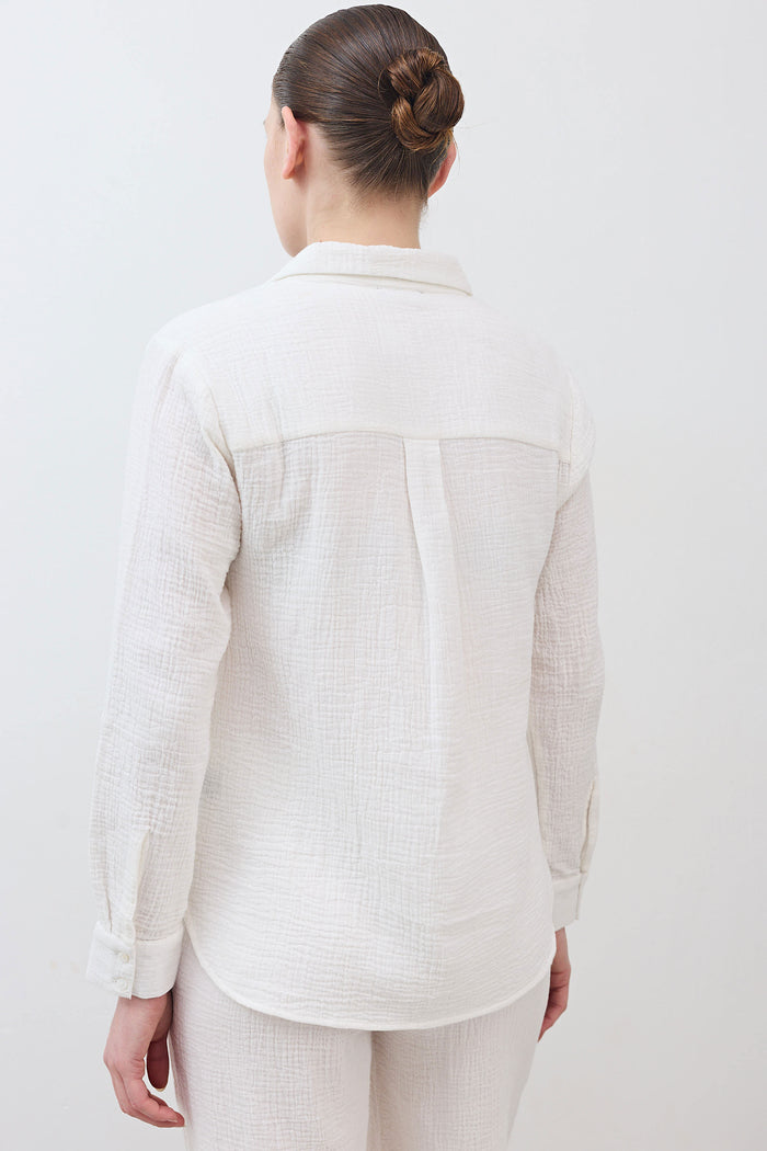 Airy button-down tunic in off-white with back yoke seam and long sleeves