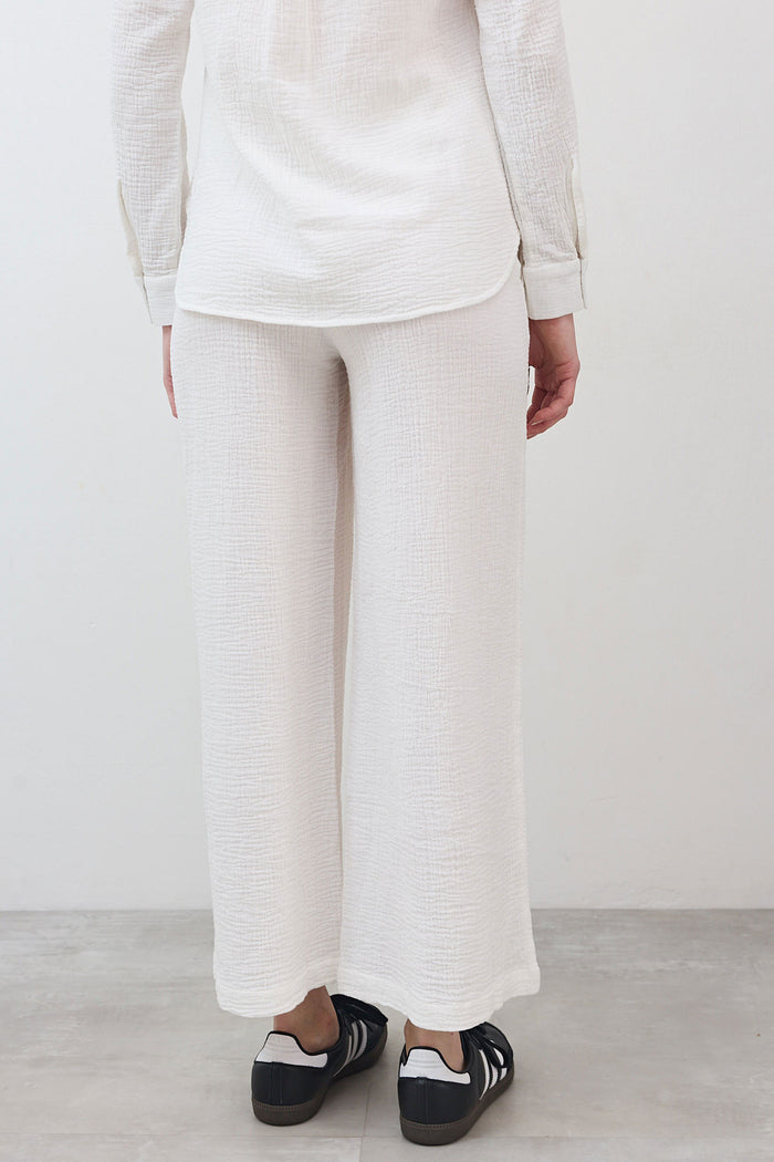 Marshmallow wide-leg pants close-up of textured fabric and wide ankle hem