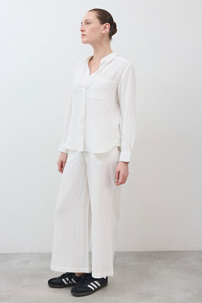 Marshmallow wide-leg pants in textured woven fabric, side view with straight drape