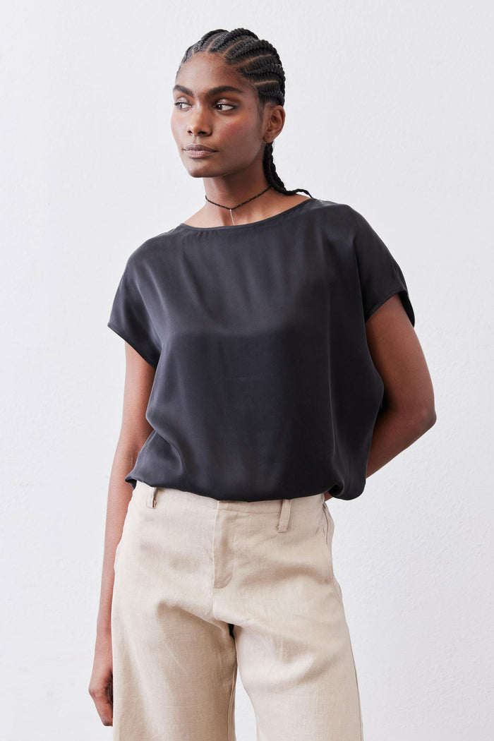 Black silk short-sleeve blouse with wide neckline and relaxed drape