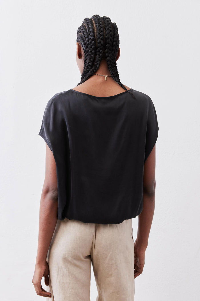 Black silk short-sleeve blouse, back neckline and flowing drape