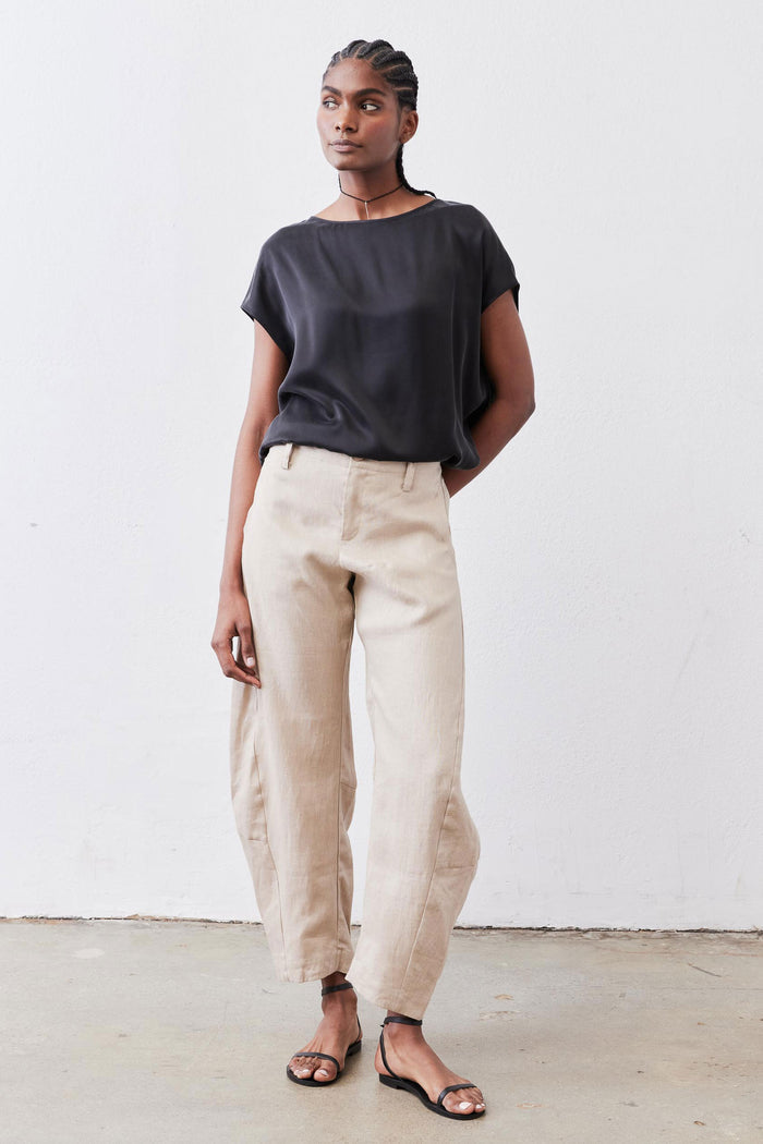 Black silk short-sleeve blouse, loose drape over waistband