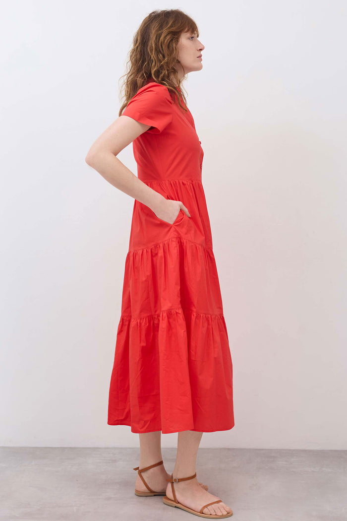 Hot coral long poplin dress with short sleeves and tiered skirt, side profile