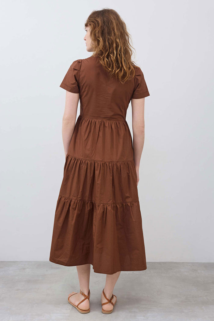 Long copper poplin dress, short sleeves, tiered skirt, gathered waist; back view