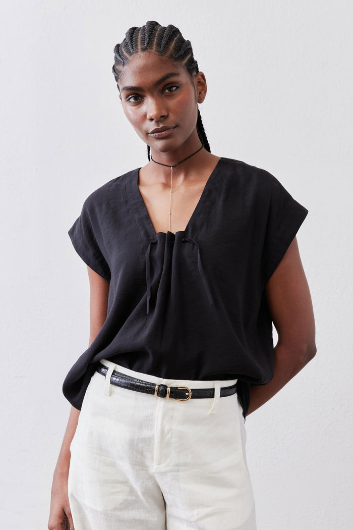 Black cinched-neck poplin top with gathered front and short sleeves, front view