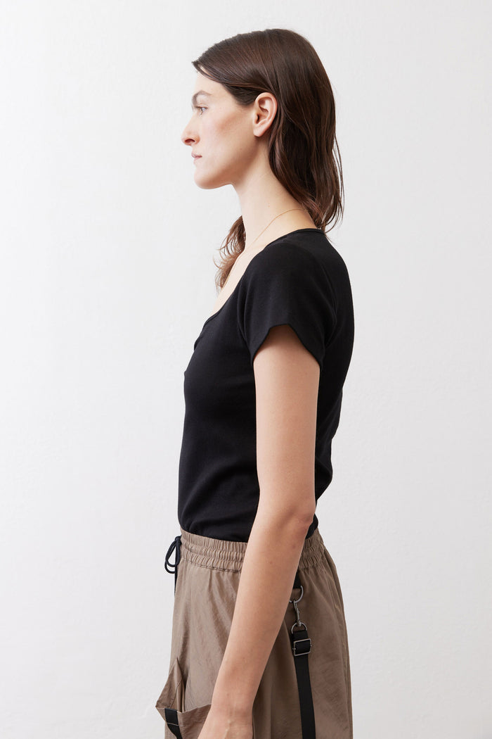 Black short-sleeve top with square neckline seam detail on the side