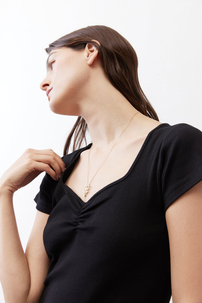 Black square-neck dipped front short-sleeve top with ruched neckline