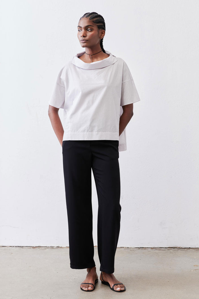 White dolman drape-neck top front view with short sleeves and draped collar