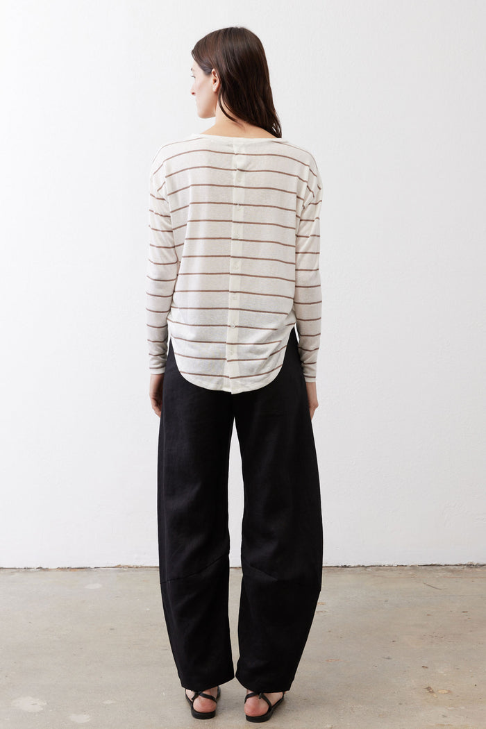 Striped long-sleeve top shown from back, off-white with tan and red stripes, button placket.