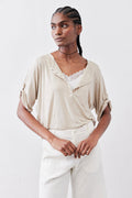 Oat half-button elbow-sleeve top with lace collar and button placket