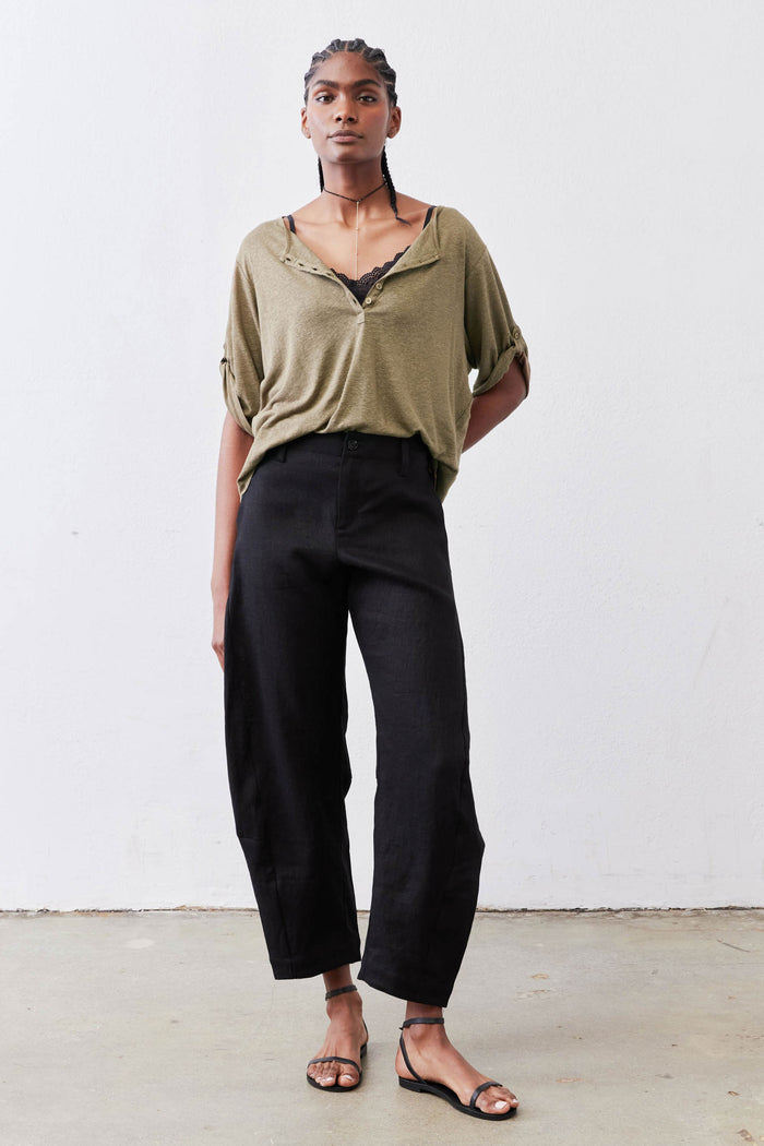 Warm olive elbow-sleeve top with half-button V-neck and relaxed drape