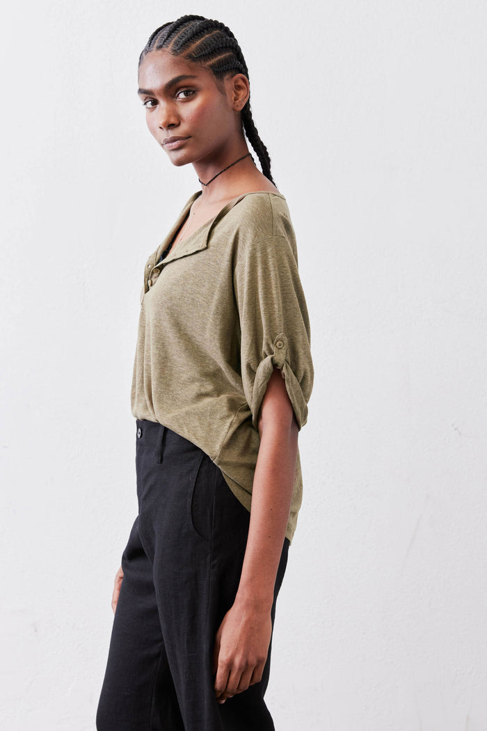 Warm olive elbow-sleeve henley top, side view with half-button V-neck