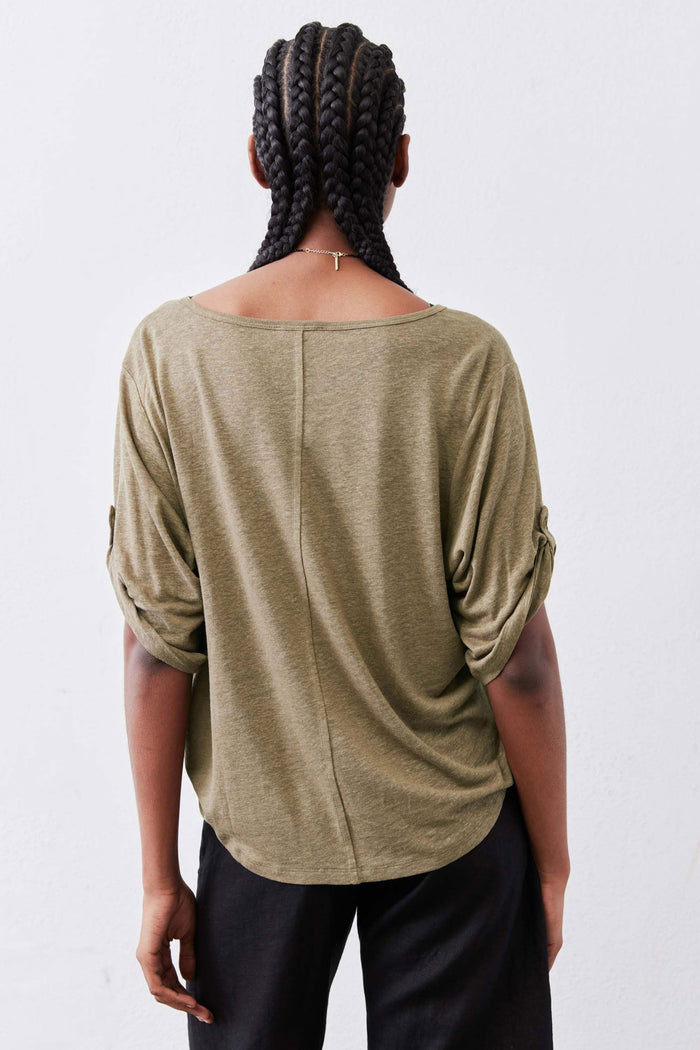 Warm olive elbow-sleeve top, back view with draped shoulder fit