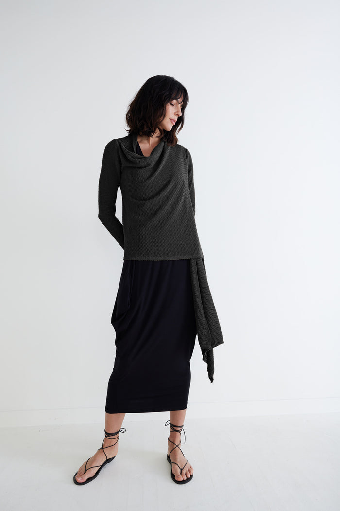 Black knit wrap cardigan with draped front, long sleeves, midi-length hem