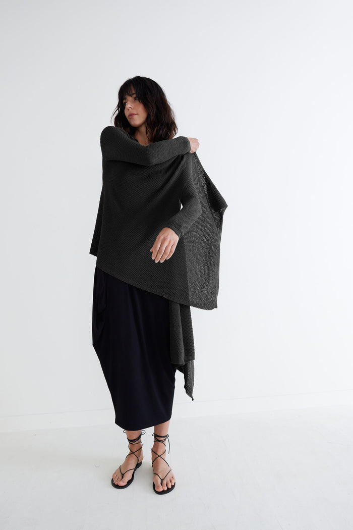 Black knit wrap cardigan with open front and draped side hem, long sleeves