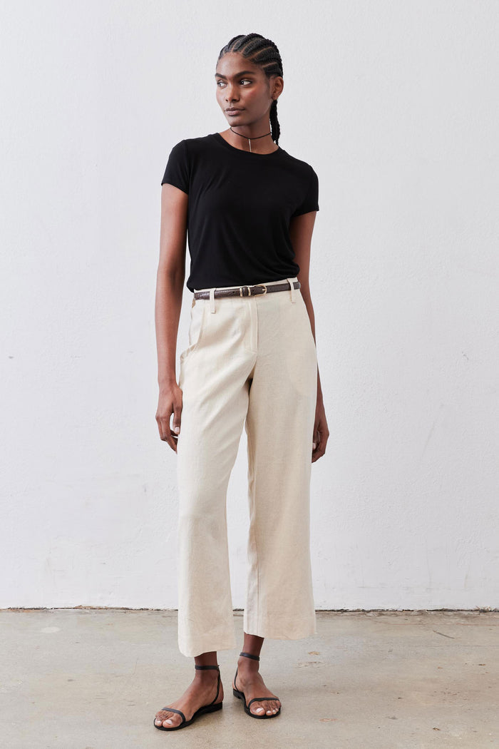 Oat linen A-line pants with wide leg cut and structured high-rise belt loops.