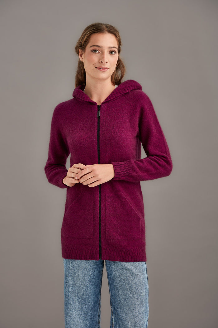 Woman wearing McDonald - Merino & Possum Stepped Stitch Hoodie (5063) in the colour Berry.