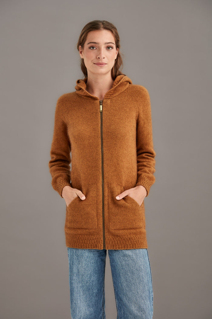 Woman wearing McDonald - Merino & Possum Stepped Stitch Hoodie (5063) in the colour Honeycomb.