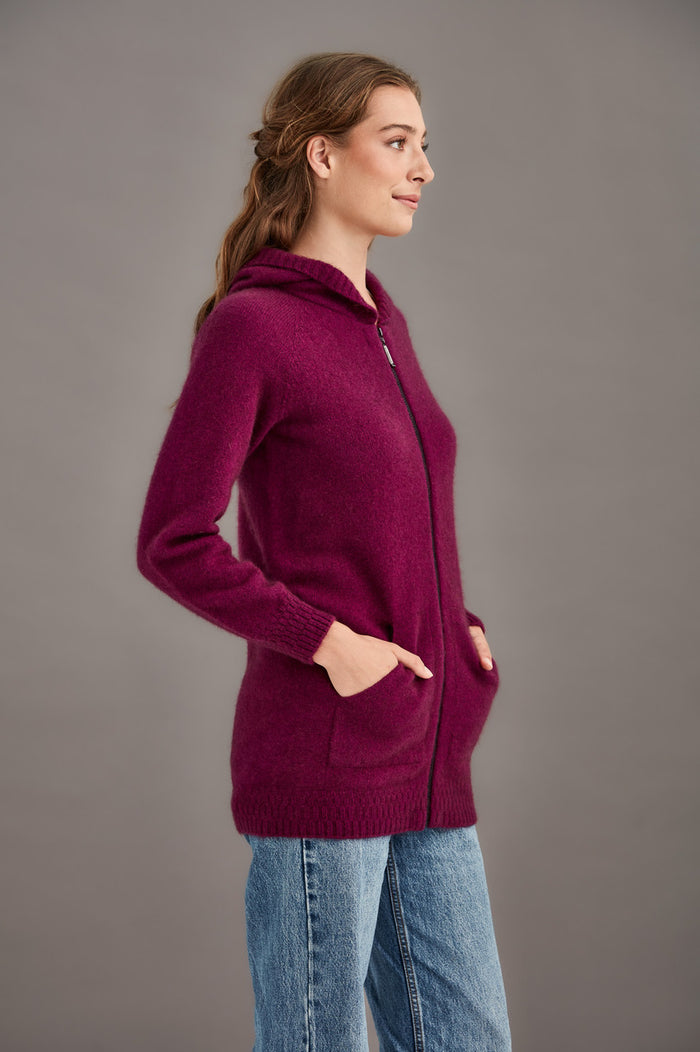 Woman wearing McDonald - Merino & Possum Stepped Stitch Hoodie (5063) in the colour Berry.
