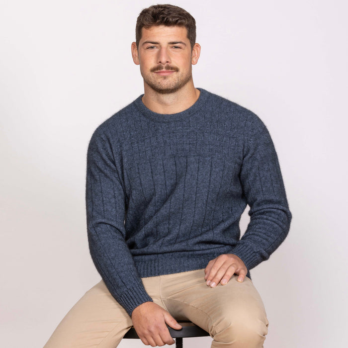 Man wearing Noble Wilde - Merino & Possum Riverton Sweater (NW1101) in the colour Neptune.