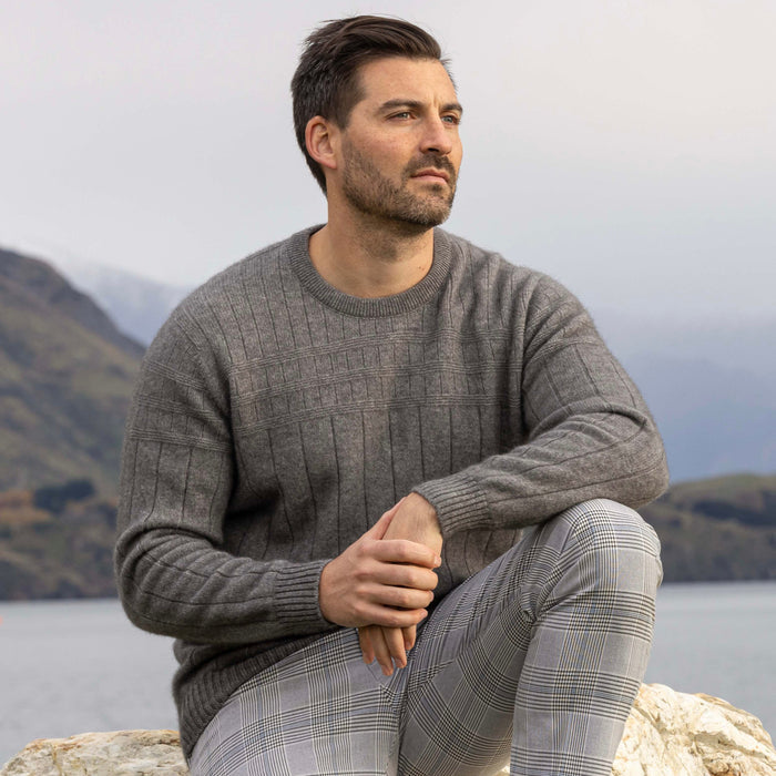 Man wearing Noble Wilde - Merino & Possum Riverton Sweater (NW1101) in the colour Shale.