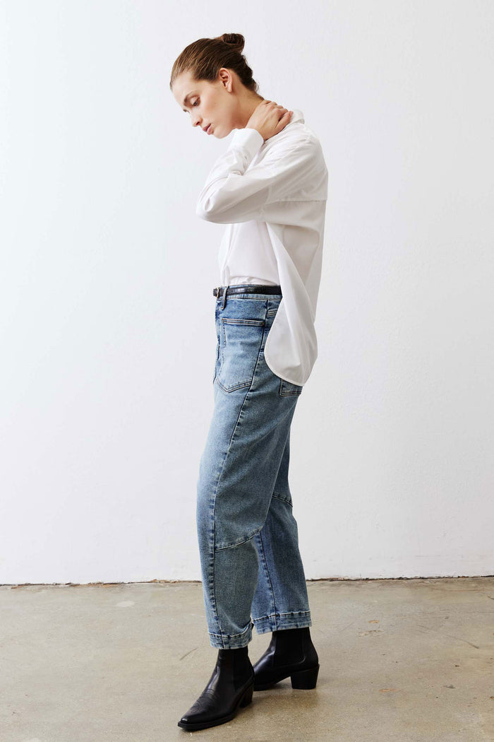 White oversized tunic shirt with point collar, button front, and long sleeves