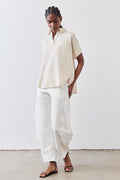 Oat linen short-sleeve blouse with collar and button placket, side view