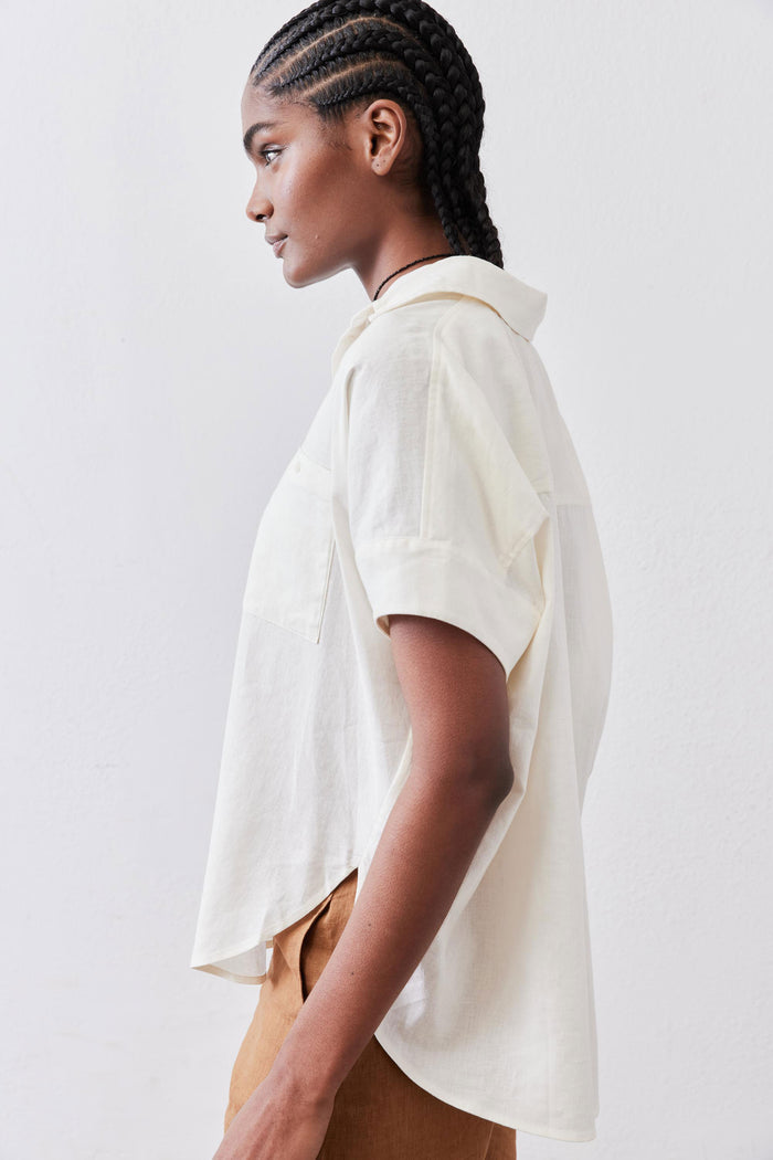 Vintage white linen pullover blouse in side view with short sleeves and point collar
