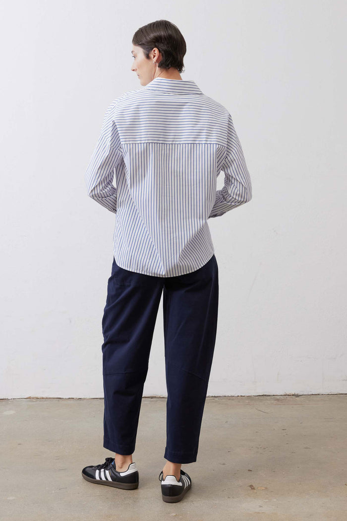 White and navy striped oversized tunic back view with yoke seam and long sleeves
