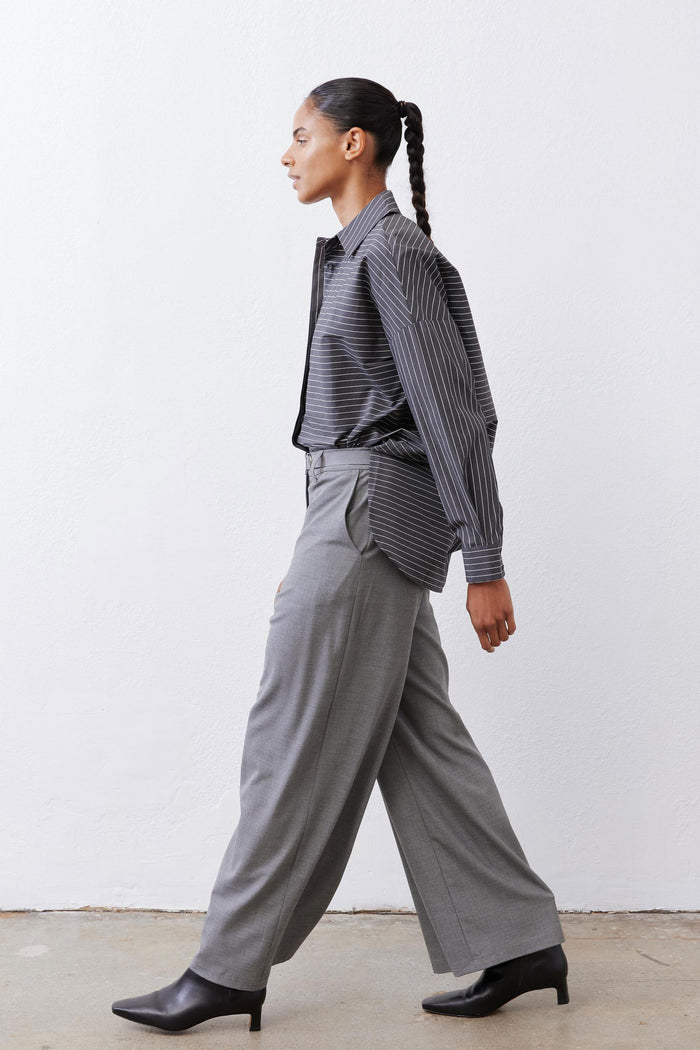 Gray-and-white striped button-down blouse with pointed collar and long sleeves