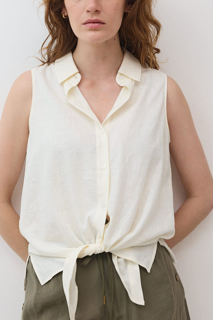 Ivory sleeveless tie-front button-down shirt with pointed collar and front buttons