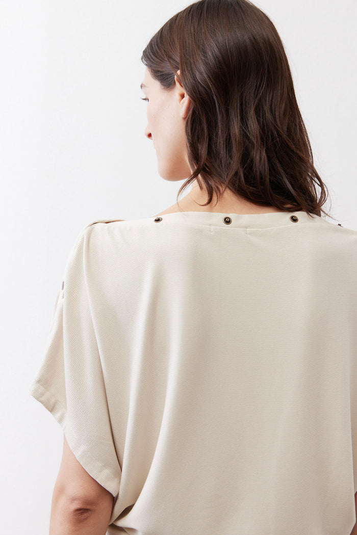 Cream short sleeve top back yoke with two buttons at shoulder