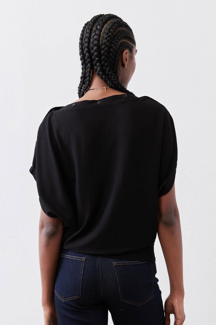 Black short-sleeve top with crew neck and relaxed back drape
