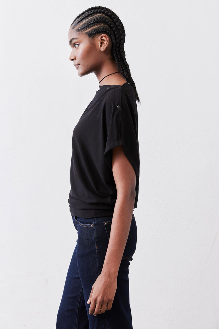Black short-sleeve top with crew neck and side profile silhouette