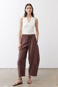 White sleeveless V-neck tank top with fitted torso and clean neckline