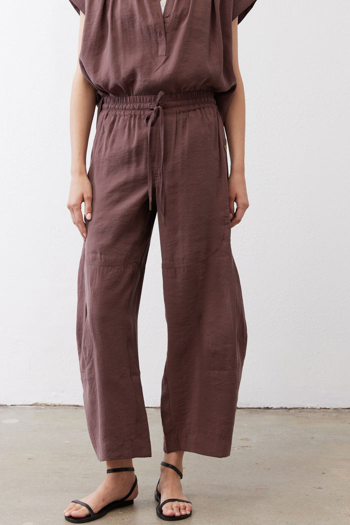 Dark brown utility pants with elastic waistband and relaxed straight-leg fit