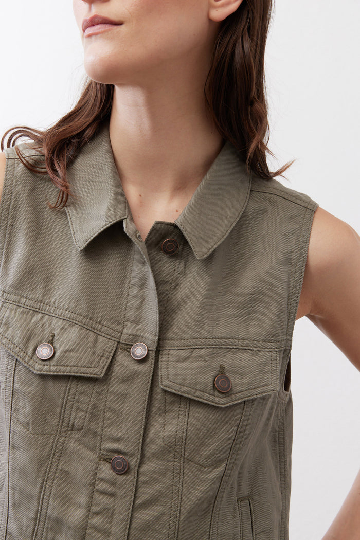 Olive sleeveless vest close-up: point collar and flap chest pockets with buttons