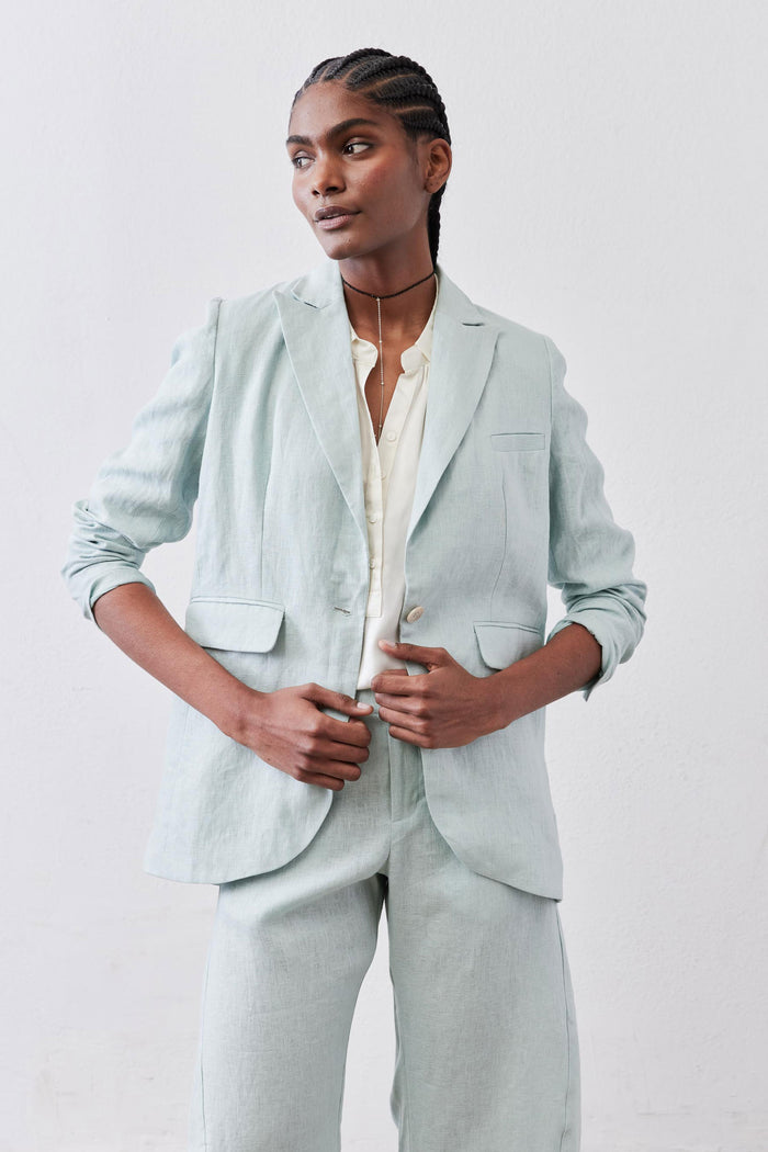 Mint linen blazer with notch lapels, two flap pockets, and single-breasted front, long sleeves