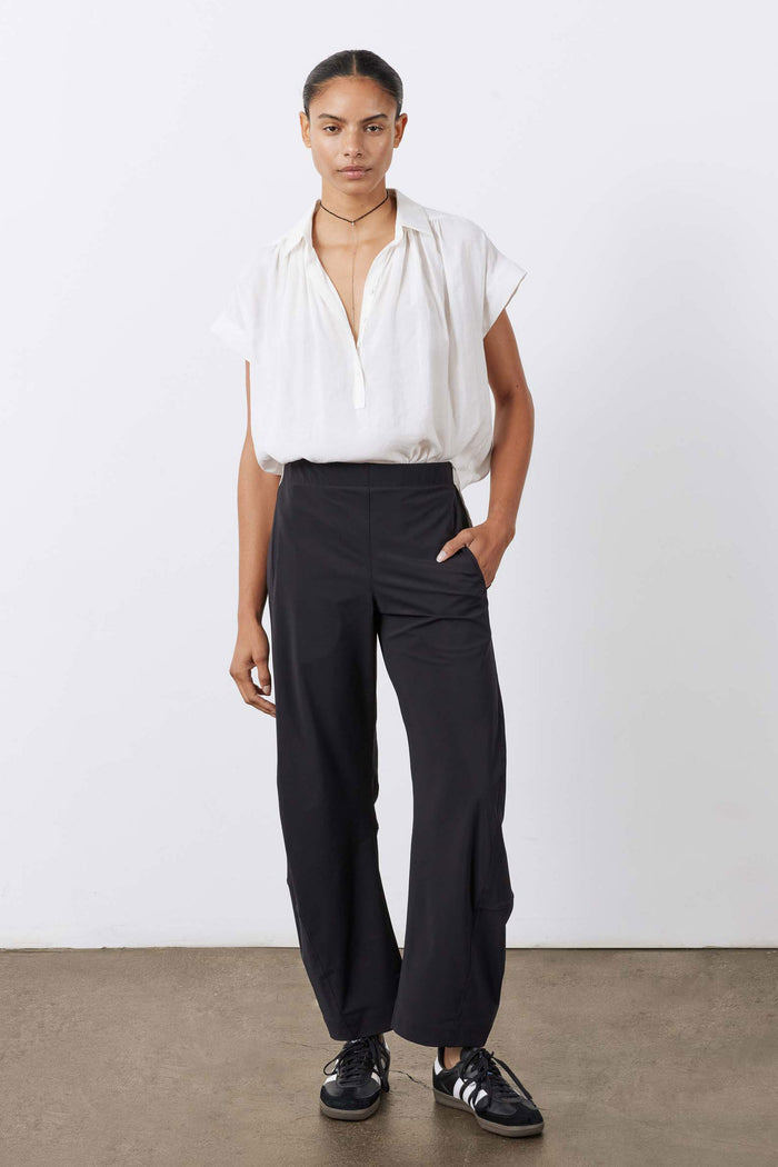 Black loose work pants with gathered waistband and wide, straight leg