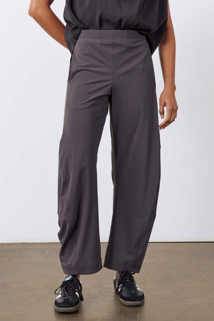 Graphite work pants front view with loose fit, fly front, and side pockets