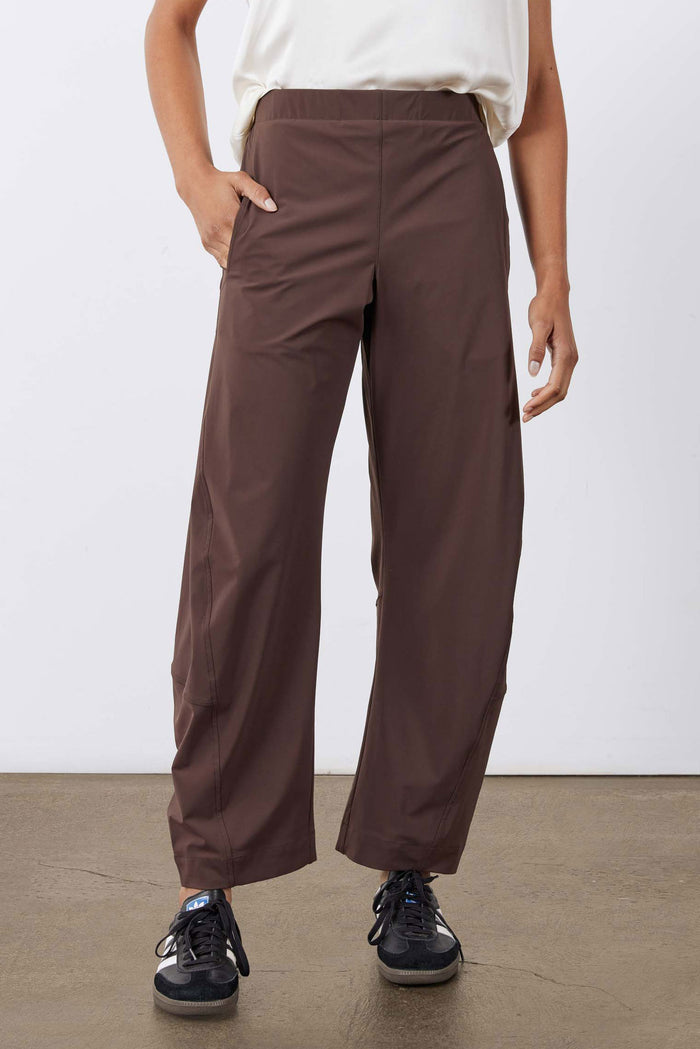 Coffee-brown wide-leg work pants with cargo-style side pockets and cuffed hem