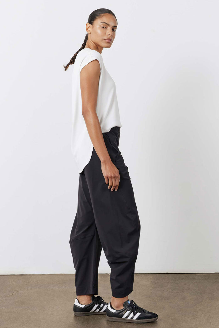 Black loose work pants with elastic waistband and wide leg opening