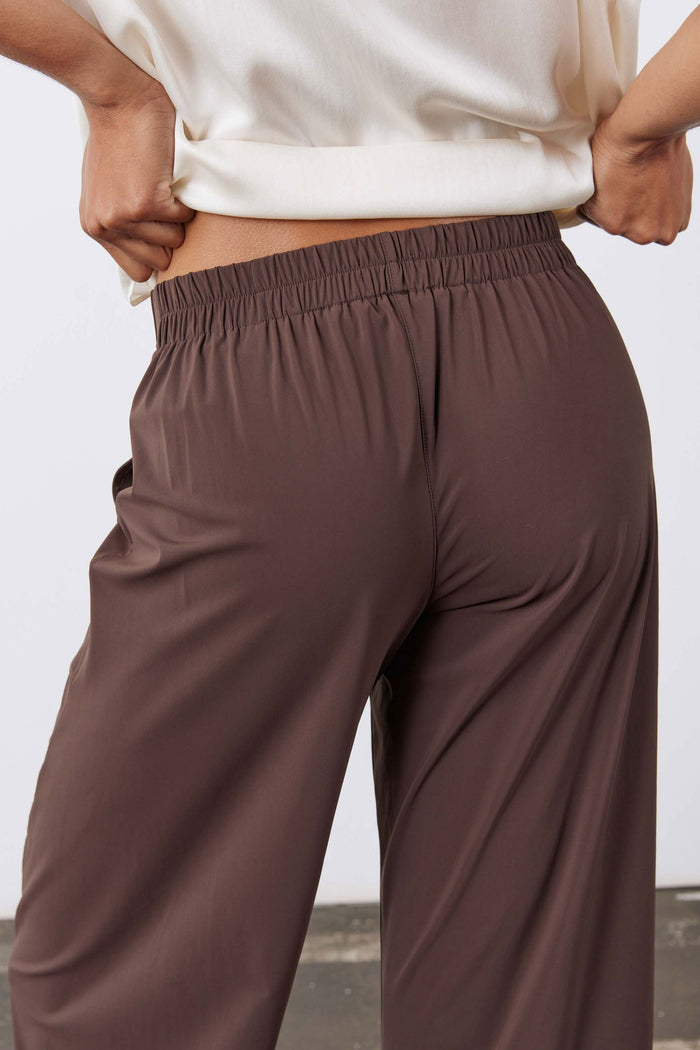 Coffee-brown pull-on work pants with elastic waistband and roomy drape legs