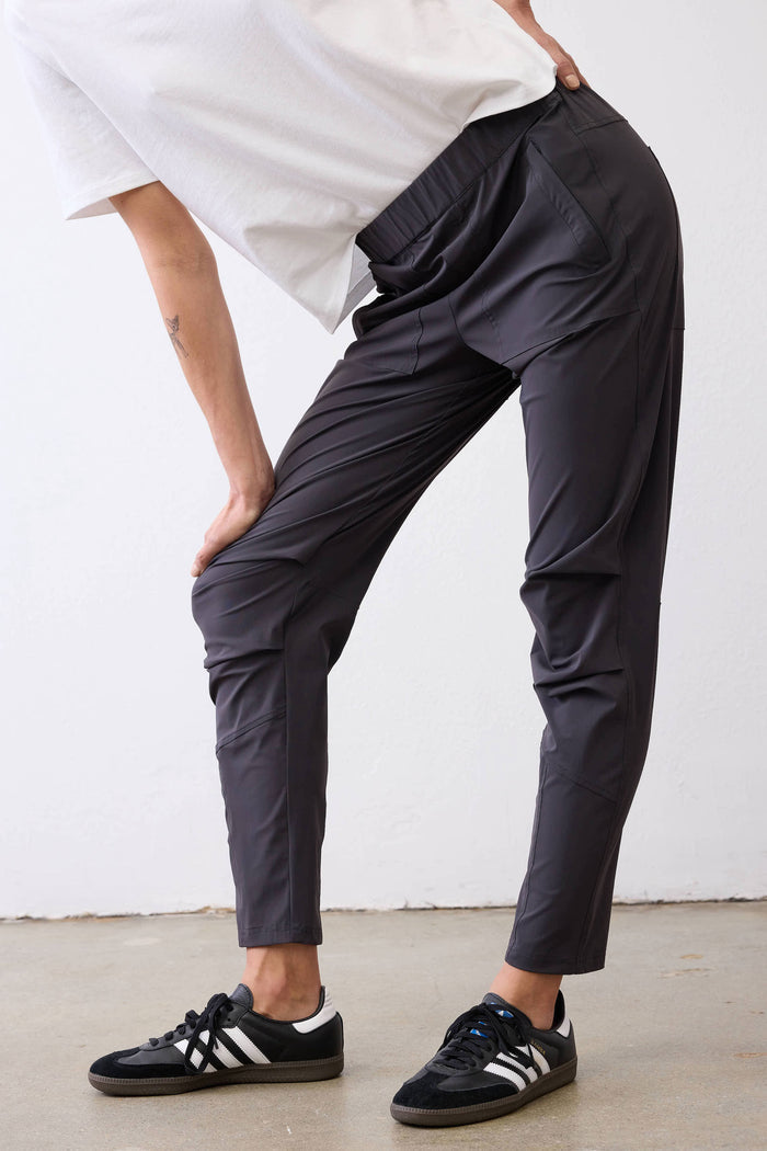 Graphite active pants with side seams and tapered leg at knee