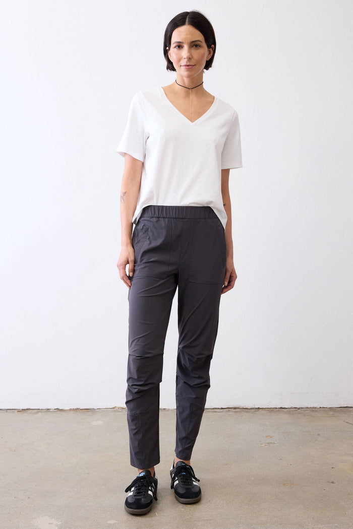 Graphite active pants on model, elastic waistband and tapered ankle cuffs