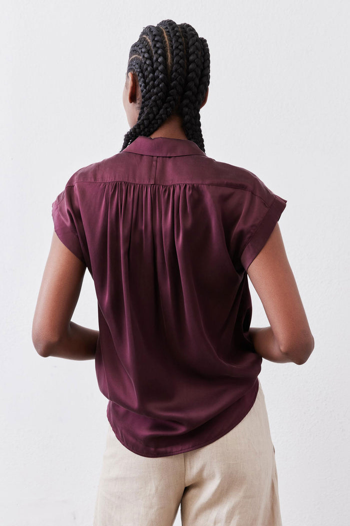 Maroon oversized silk blouse, back view with pleated yoke and short sleeves.