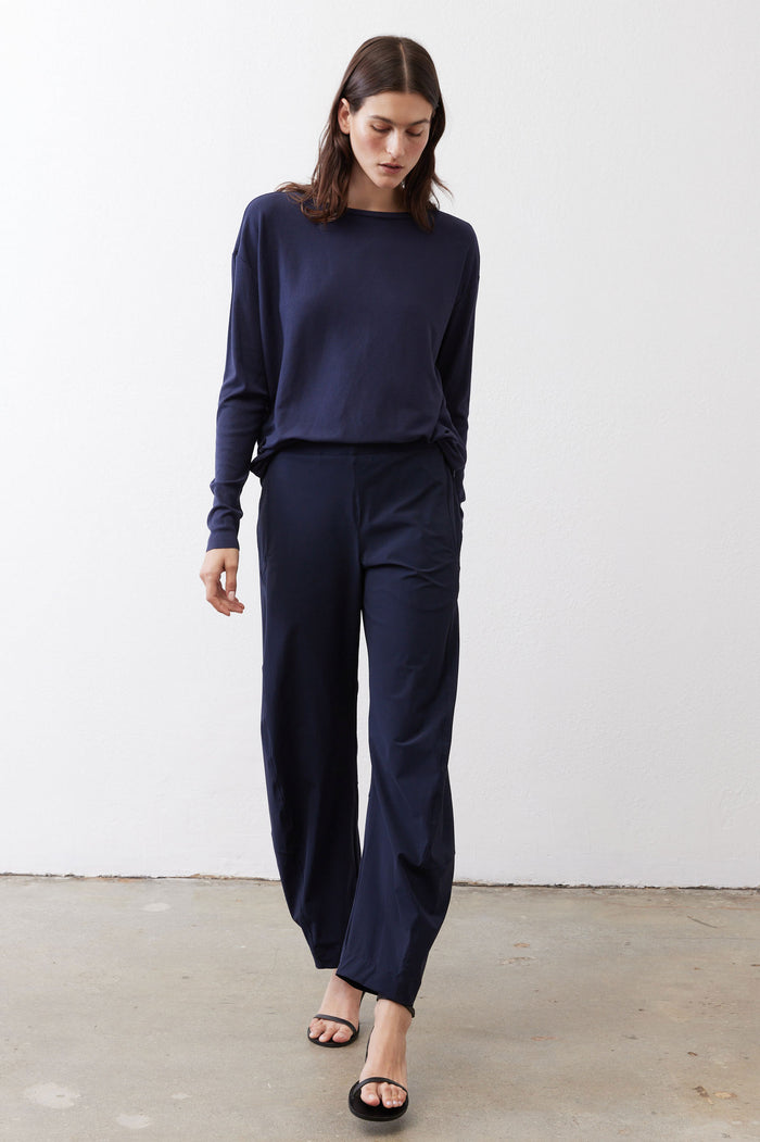 Deep navy loose work pants, full front view with elastic drawstring waist and tapered leg.