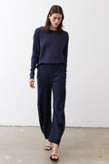 Deep navy loose work pants, full front view with elastic drawstring waist and tapered leg.