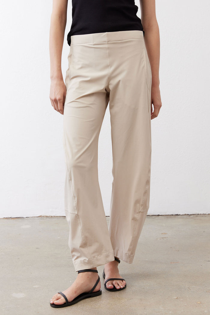 Light beige work pants with relaxed straight legs, cuffed at the ankle