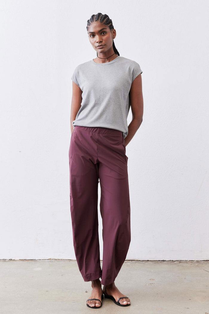 Relaxed aubergine work pants with loose wide-leg fit and elastic waist, ankle-length